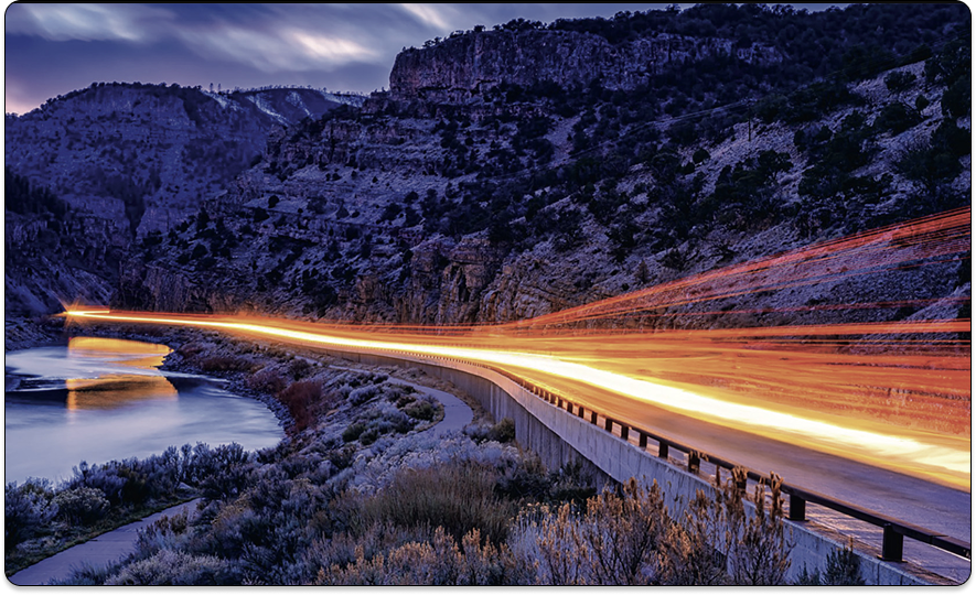 Highway at night with light trails